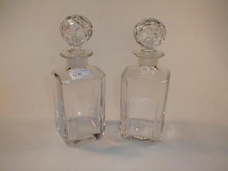 A pair of heavy crystal square decanters engraved whisky and brandy