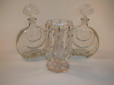 A cut glass lustre and a pair of moulded eau de cologne bottles