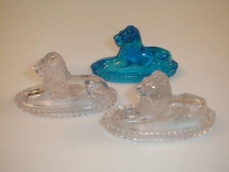 Three Derbyshire type pressed glass seated lions