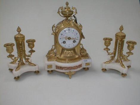 A French ormolu and white onyx mantel clock garniture with floral painted