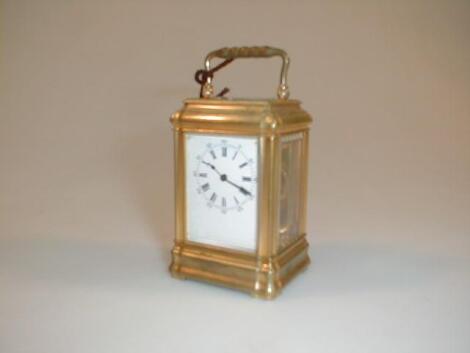 A miniature gilt brass carriage timepiece