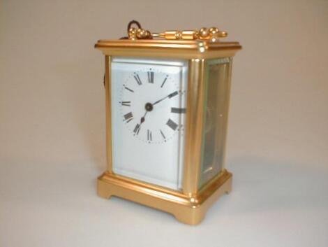 A gilt brass carriage timepiece