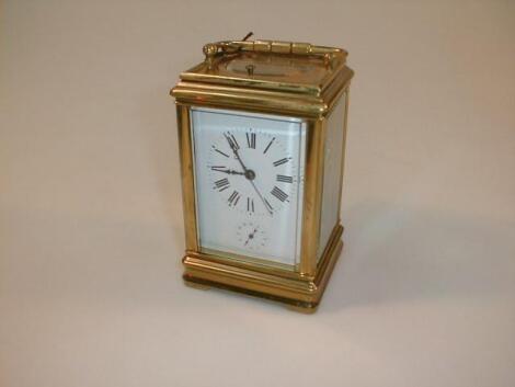 A gilt brass repeater carriage clock