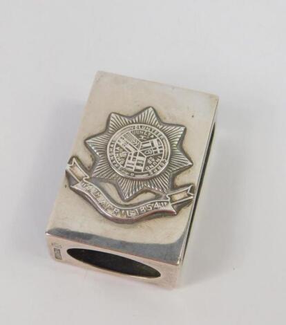 A Chinese silver match sleeve embossed with the Garter badge of The Shanghai Volunteer Corps