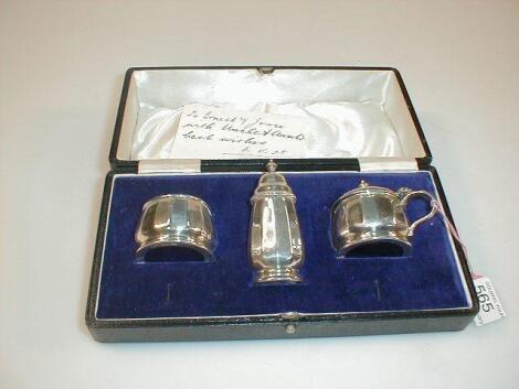 A cased silver three-piece silver cruet by Walker & Hall