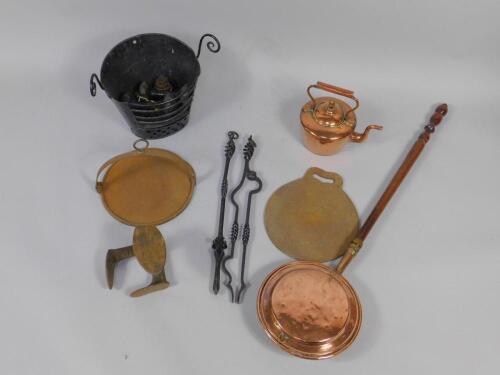 A group of cast iron and copper wares