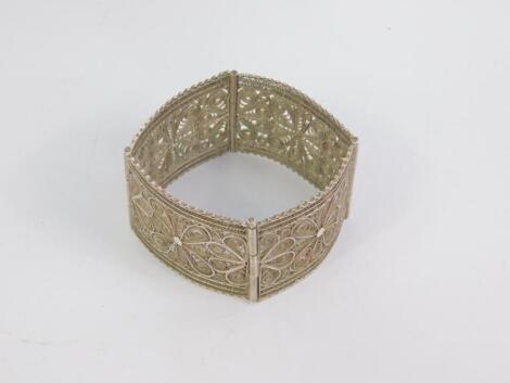 A Continental white metal filigree four section cuff