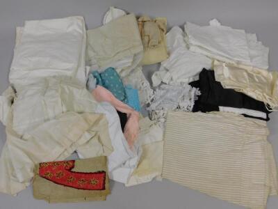 A suitcase containing Victorian and later lace and linen costume and under garments.