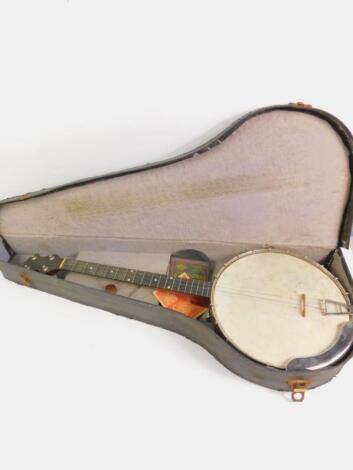 A mahogany and metal cased tenor banjo