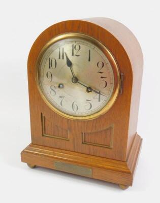 A Junghans early 20thC oak cased mantel clock