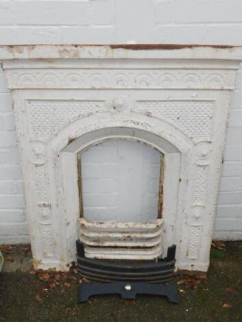 A Victorian white painted cast iron bedroom fire place and surround