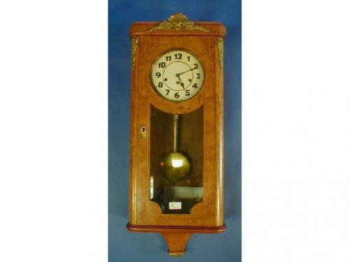 A Junghans burr walnut venereed wall clock with eight day chiming movement