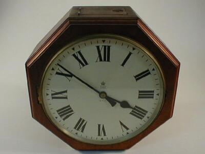 A GPO double faced wall clock with mahogany octagonal case