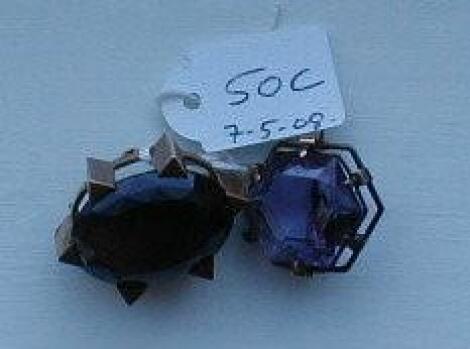 Two large amethyst and topaz set brooches