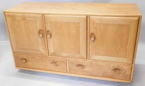 An Ercol light elm sideboard