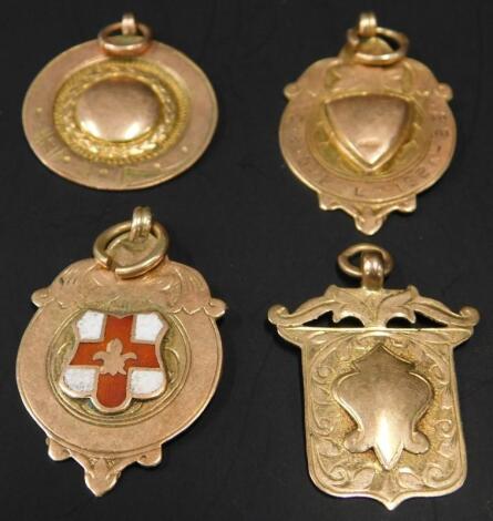 Four 9ct gold fobs