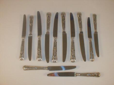 A set of six silver handled Kings pattern table knives and matching dessert knives