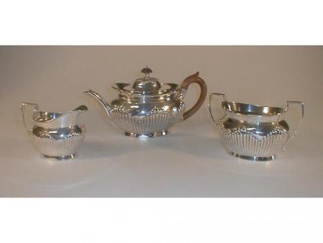 A Victorian silver tea service. of oval semi lobed form