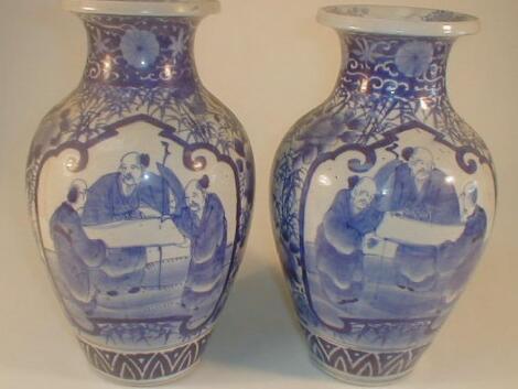 A pair of Japanese blue and white baluster vases