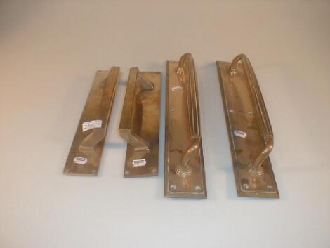 Two pairs of brass door handles with rectangular back plates