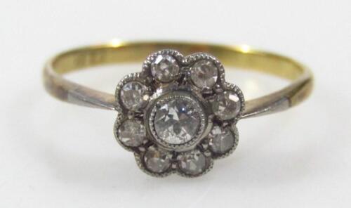 A diamond floral cluster ring