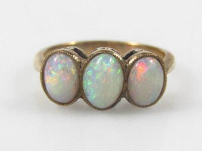 A three stone opal dress ring