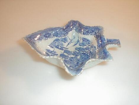 A single 19th century Staffordshire blue and white willow pattern leaf