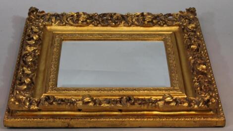 An 18thC style gilt wood rococo style mirror