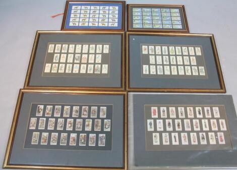 Various framed cigarette cards