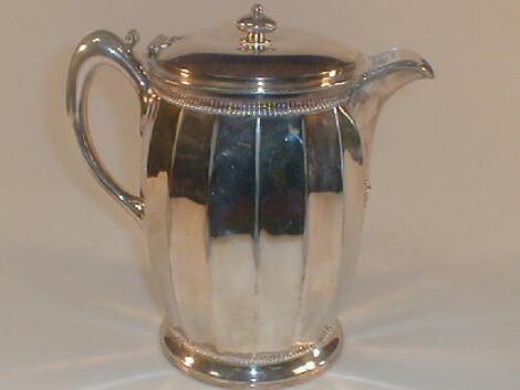 A lined electroplate serving jug marked 'Meridon & Co 280 USA'