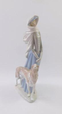 A Lladro porcelain figure of a lady with a saluki