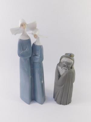 A Lladro porcelain figure of two nuns