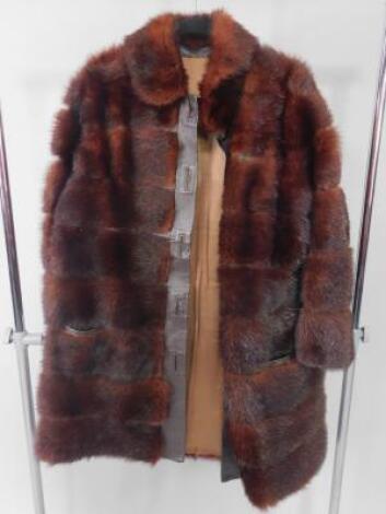 A Fantasia Furs mink and leather trimmed coat.