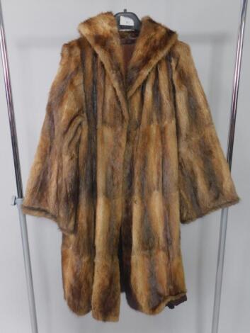 A lady's musquash fur coat.