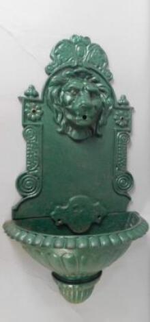 A Victorian style green painted cast iron garden wall fountain