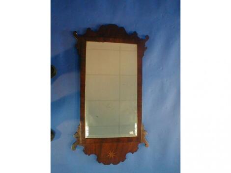 An 18th century mahogany framed wall mirror with bevelled glass and fret