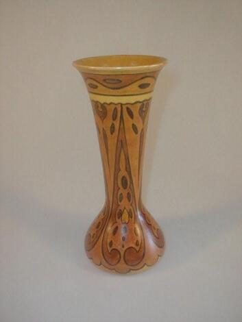 A Chameleon ware pottery vase of elongated baluster form