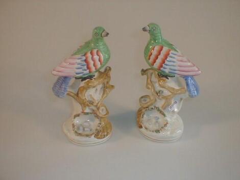 A pair of Victorian Staffordshire pottery bird groups