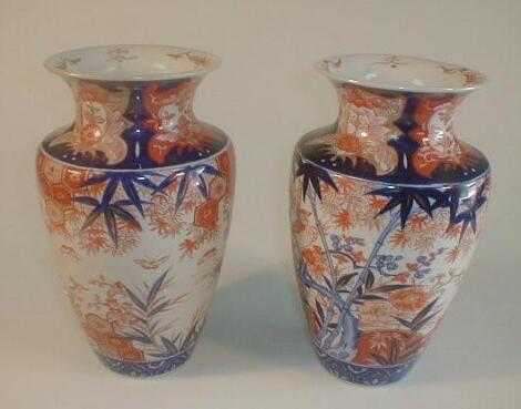 A pair of Meiji period Imari vases of shouldered ovoid form