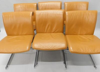 A set of six Zanuso style tan coloured leather and chrome dining chairs