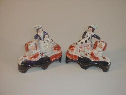 A pair of Victorian Staffordshire pottery figure groups