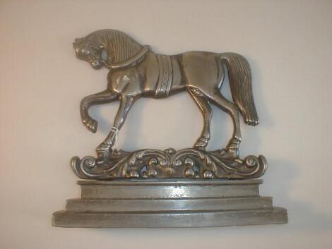 A 19th century cast pewter door porter in the form of a horse