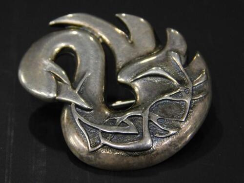 A silver Ola Gorie swan brooch