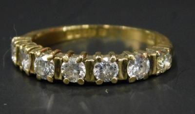 An 18ct gold diamond half hoop eternity ring