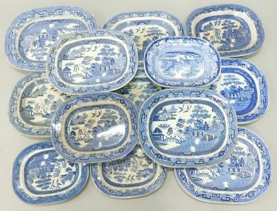 A collection of 19thC and later blue and white Willow pattern meat dishes