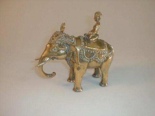 An Indian brass caparisoned elephant and mahout