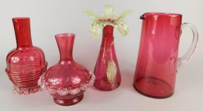 A collection of cranberry glass