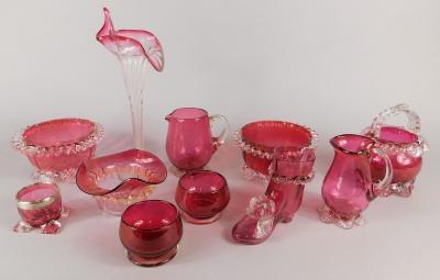 A collection of cranberry tinted glass