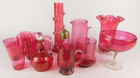 A collection of cranberry tinted glass