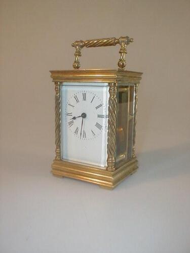 An early 20thC gilt brass carriage timepiece